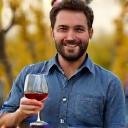 Man holding a glass of wine.